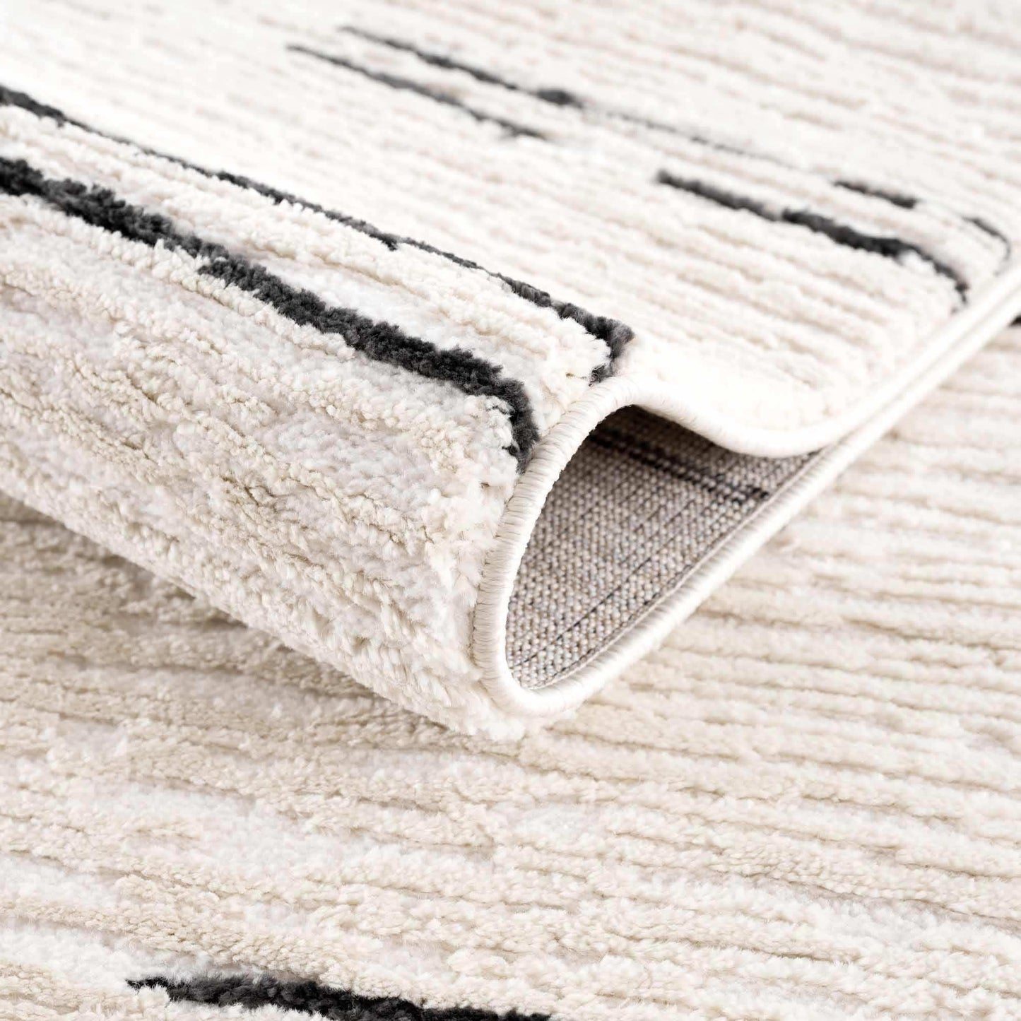 Riad Black Striped White Rug with Tassels