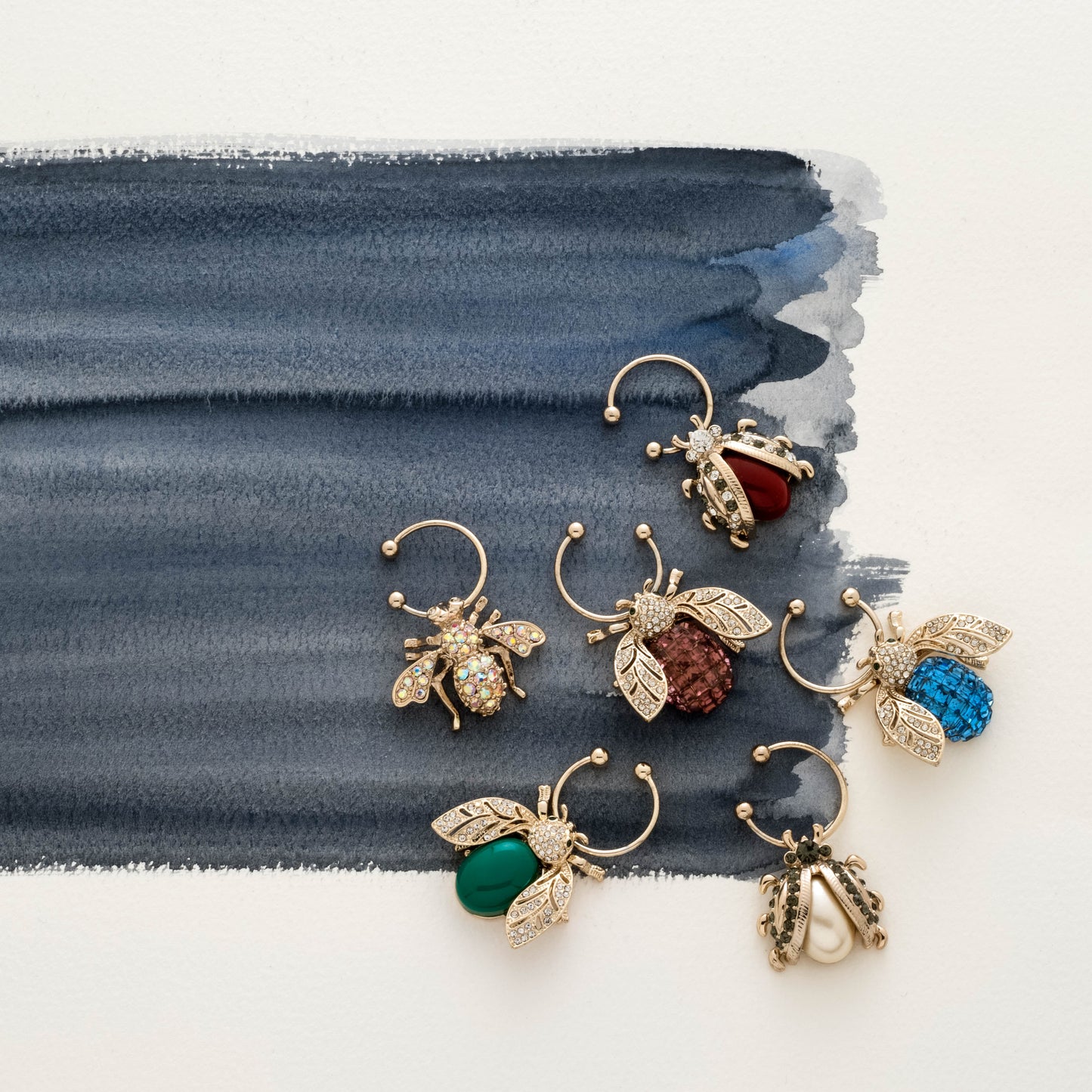 Bedazzled bee wine charms, dark jewel tones